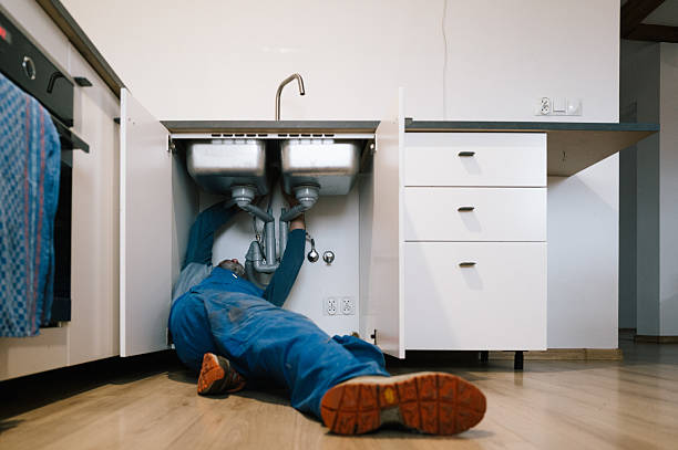 Professional Drain Cleaning technician working in Wellsville, MO
